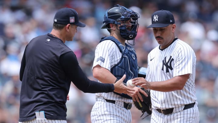 Jul 20, 2024; Bronx, New York, USA; New York Yankees starting pitcher Nestor Cortes (65) is taken out of the game against the Tampa Bay Rays by manager Aaron Boone (17) during the fifth inning at Yankee Stadium.