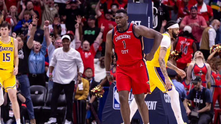 Apr 16, 2024; New Orleans, Louisiana, USA; New Orleans Pelicans forward Zion Williamson (1) reacts to making a basket against Los Angeles Lakers forward Anthony Davis (3) during the second half of a play-in game of the 2024 NBA playoffs at Smoothie King Center. 