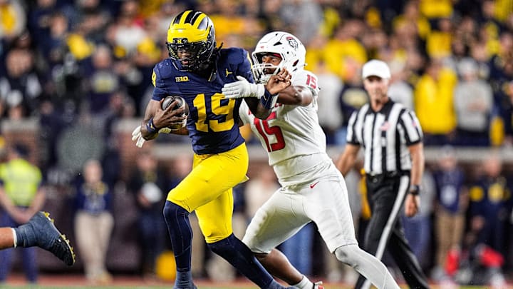 Michigan quarterback Bryce Underwood (19) is tackled by New Mexico defensive tackle Xavier Slayton (15) during the second half at Michigan Stadium in Ann Arbor on Saturday, August 30, 2025. Michigan quarterback Bryce Underwood (19) is tackled by New Mexico defensive tackle Xavier Slayton (15) during the second half at Michigan Stadium in Ann Arbor on Saturday, August 30, 2025.