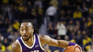 Nov 15, 2024; Ann Arbor, Michigan, USA;  TCU Horned Frogs guard Frankie Collins (11) dribbles in the second half against the Michigan Wolverines at Crisler Center. Mandatory Credit: Rick Osentoski-Imagn Images