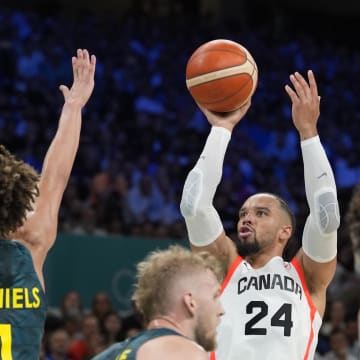 Jul 30, 2024; Villeneuve-d'Ascq, France; Canada small forward Dillon Brooks (24) shoots against Australia point guard Dyson Daniels (1) in a men's group stage basketball match during the Paris 2024 Olympic Summer Games at Stade Pierre-Mauroy. Mandatory Credit: John David Mercer-USA TODAY Sports