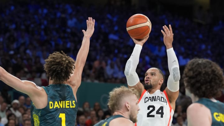 Jul 30, 2024; Villeneuve-d'Ascq, France; Canada small forward Dillon Brooks (24) shoots against Australia point guard Dyson Daniels (1) in a men's group stage basketball match during the Paris 2024 Olympic Summer Games at Stade Pierre-Mauroy. Mandatory Credit: John David Mercer-USA TODAY Sports