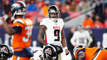 Nov 17, 2024; Denver, Colorado, USA; Atlanta Falcons quarterback Michael Penix Jr. (9) at the line of scrimmage in the fourth quarter against the Denver Broncos  at Empower Field at Mile High. Mandatory Credit: Ron Chenoy-Imagn Images