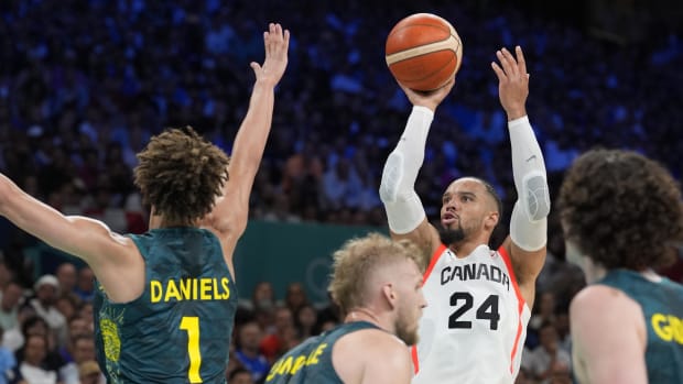 Canada small forward Dillon Brooks (24) shoots against Australia point guard Dyson Daniels (1) in a men's group stage basketb