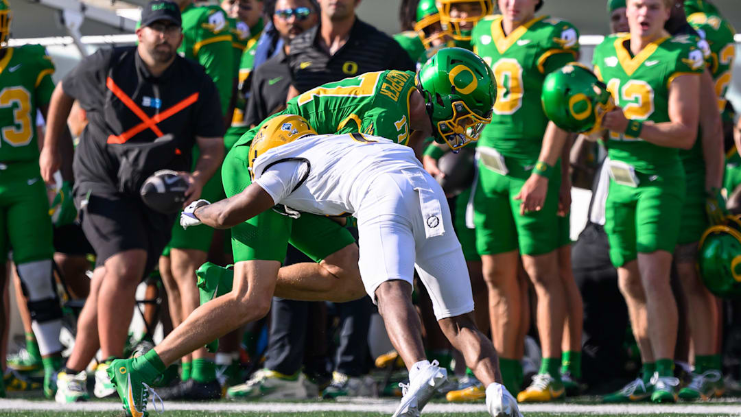 Aug 31, 2024; Eugene, Oregon, USA; Idaho Vandals defensive back Andrew Marshall (7) tackles Oregon Ducks wide receiver Kyler Kasper (17) during the first half at Autzen Stadium. Mandatory Credit: Craig Strobeck-Imagn Images