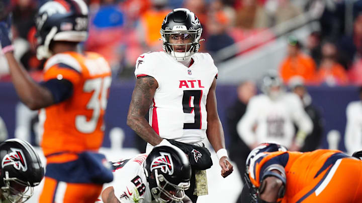 Ex-Husky quarterback Michael Penix Jr. surveys the Denver Broncos defense in one of his two NFL outings. Ex-Husky quarterback Michael Penix Jr. surveys the Denver Broncos defense in one of his two NFL outings.