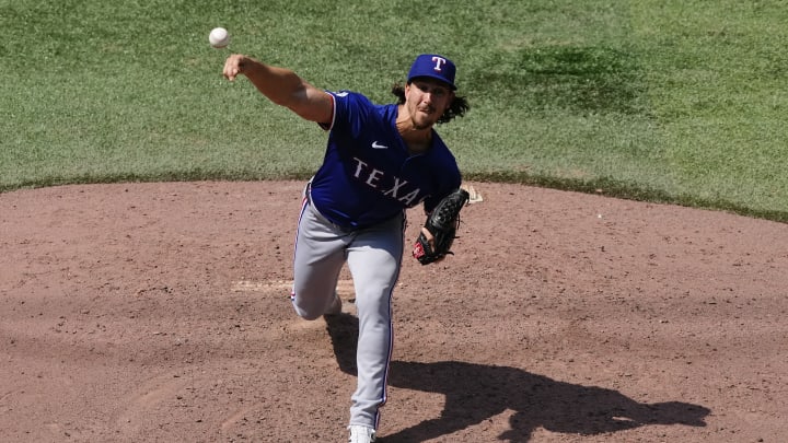 Jul 28, 2024; Toronto, Ontario, CAN; Texas Rangers pitcher Michael Lorenzen (23) pitches to the Toronto Blue Jays during the sixth inning at Rogers Centre. Mandatory Credit: John E. Sokolowski-USA TODAY Sports