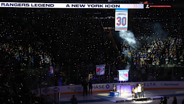 Jan 28, 2022; New York, New York, USA; New York Rangers former goalie Henrik Lundqvist watches with his family as his banner is raised to the ceiling during a ceremony to retire his number before a game against the Minnesota Wild at Madison Square Garden. Mandatory Credit: Brad Penner-Imagn Images