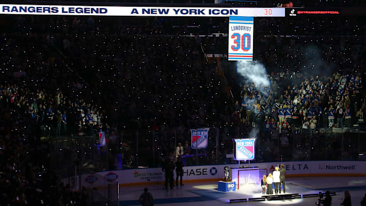 Jan 28, 2022; New York, New York, USA; New York Rangers former goalie Henrik Lundqvist watches with his family as his banner is raised to the ceiling during a ceremony to retire his number before a game against the Minnesota Wild at Madison Square Garden. Mandatory Credit: Brad Penner-Imagn Images