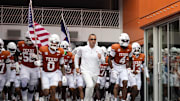 Texas Longhorns head coach Steve Sarkisian leads players on to the field before the game against the San Jose State Spartans at Darrell K Royal-Texas Memorial Stadium.