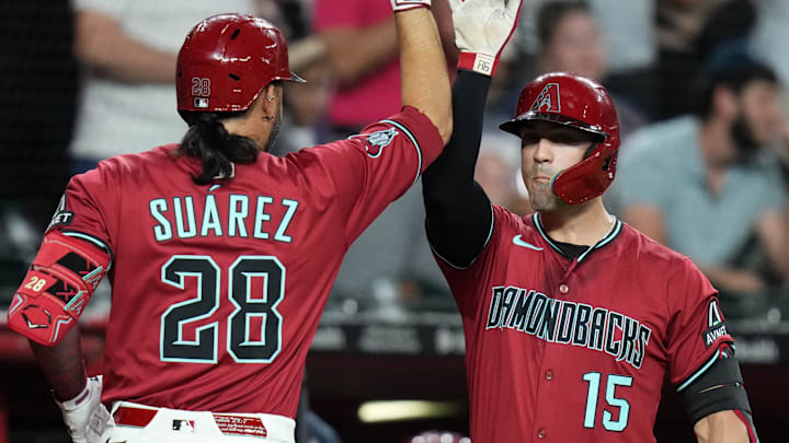 Diamondbacks third baseman Eugenio Suarez, left, is widely seen as the best power bat available ahead of the trade deadline.