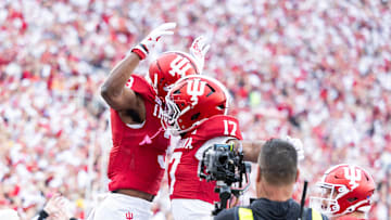 Nov 9, 2024; Bloomington, Indiana, USA; Indiana Hoosiers wide receiver Omar Cooper Jr.  celebrates his touchdown with teammates in the first quarter against the Michigan Wolverines at Memorial Stadium. Mandatory Credit: Trevor Ruszkowski-Imagn Images