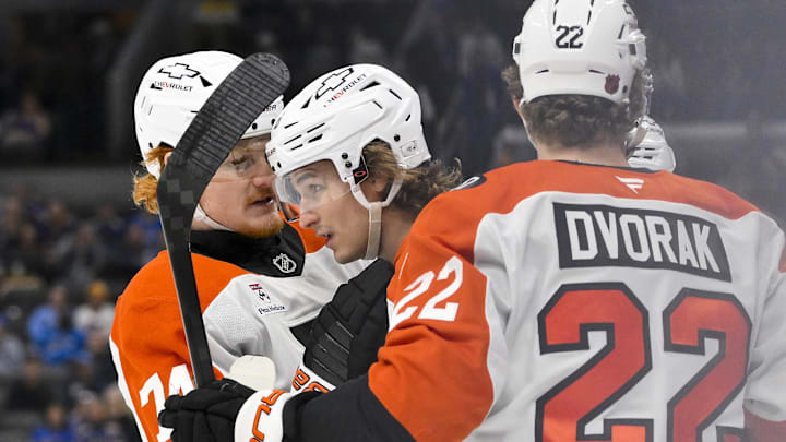 Nov 14, 2025; St. Louis, Missouri, USA; Philadelphia Flyers center Trevor Zegras (46) is congratulated by right wing Owen Tippett (74) and center Christian Dvorak (22) after scoring against the St. Louis Blues during the first period at Enterprise Center.