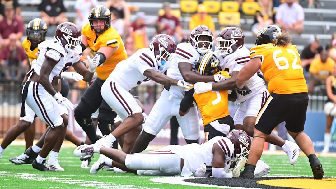 Southern Miss Golden Eagles wide receiver Chuck Montgomery (3) is stopped by members of the Mississippi State Bulldogs defense during the fourth quarter at M.M. Roberts Stadium in Hattiesburg, Miss., on Aug. 30, 2025.