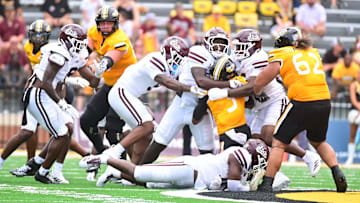 Southern Miss Golden Eagles wide receiver Chuck Montgomery (3) is stopped by members of the Mississippi State Bulldogs defense during the fourth quarter at M.M. Roberts Stadium in Hattiesburg, Miss., on Aug. 30, 2025.