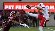 Nov 1, 2025; Blacksburg, Va.; Virginia Tech running back P.J. Prioleau (20) blocks a punt by Louisville's punter.