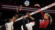 Wisconsin middle blocker Carter Booth (52) and opposite Devyn Robinson (10) attempt to block the shot from Nebraska middle blocker Andi Jackson (15) during the first set of their game on Friday November 24, 2023 at the UW Field House in Madison, Wis.