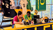 Bellevue offensive linemen Willi Wascher (USC), left, and Demetri Manning (Oregon) sign their letters of intent in the early period Wednesday at school.