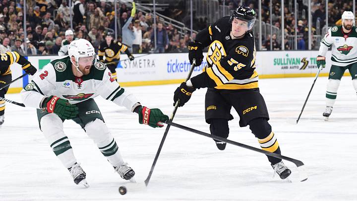 Mar 28, 2026; Boston, Massachusetts, USA; Boston Bruins forward Lukas Reichel shoots the puck while Minnesota Wild defenseman Jeff Petry (2) defends during the third period at TD Garden. Mandatory Credit: Bob DeChiara-Imagn Images Mar 28, 2026; Boston, Massachusetts, USA; Boston Bruins forward Lukas Reichel shoots the puck while Minnesota Wild defenseman Jeff Petry (2) defends during the third period at TD Garden. Mandatory Credit: Bob DeChiara-Imagn Images