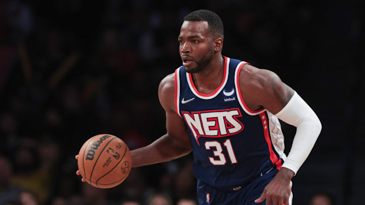 Brooklyn Nets forward Paul Millsap dribbles up court against the Chicago Bulls.