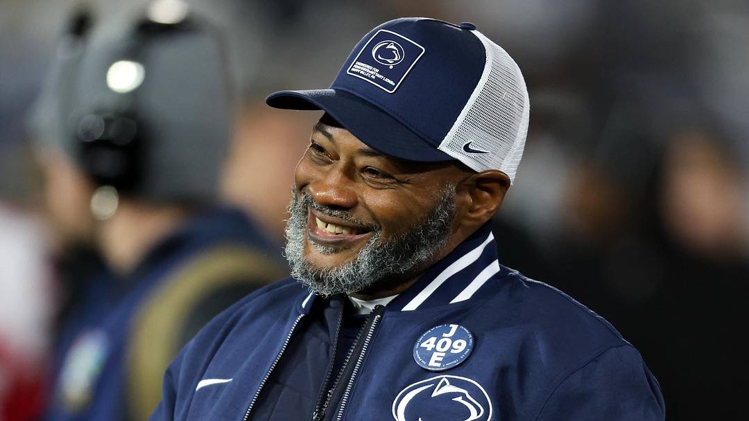 Nov 22, 2025; University Park, Pennsylvania, USA; Penn State Nittany Lions interim head coach Terry Smith walks on the field during a warm up prior to the game against the Nebraska Cornhuskers at Beaver Stadium. Mandatory Credit: Matthew O'Haren-Imagn Images
