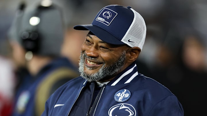 Nov 22, 2025; University Park, Pennsylvania, USA; Penn State Nittany Lions interim head coach Terry Smith walks on the field during a warm up prior to the game against the Nebraska Cornhuskers at Beaver Stadium. Mandatory Credit: Matthew O'Haren-Imagn Images