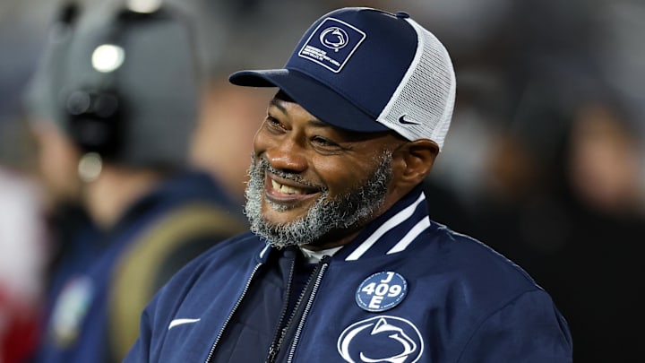 Nov 22, 2025; University Park, Pennsylvania, USA; Penn State Nittany Lions interim head coach Terry Smith walks on the field during a warm up prior to the game against the Nebraska Cornhuskers at Beaver Stadium. Mandatory Credit: Matthew O'Haren-Imagn Images