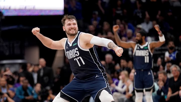 Mar 29, 2024; Sacramento, California, USA; Dallas Mavericks guard Luka Doncic (77) celebrates after the Mavericks made a three point basket against the Sacramento Kings late in the fourth quarter at the Golden 1 Center. Mandatory Credit: Cary Edmondson-USA TODAY Sports