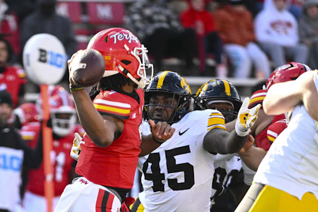 Iowa Hawkeyes defensive lineman Deontae Craig (45) rushes as Maryland Terrapins quarterback MJ Morris (7) attempts to throw.