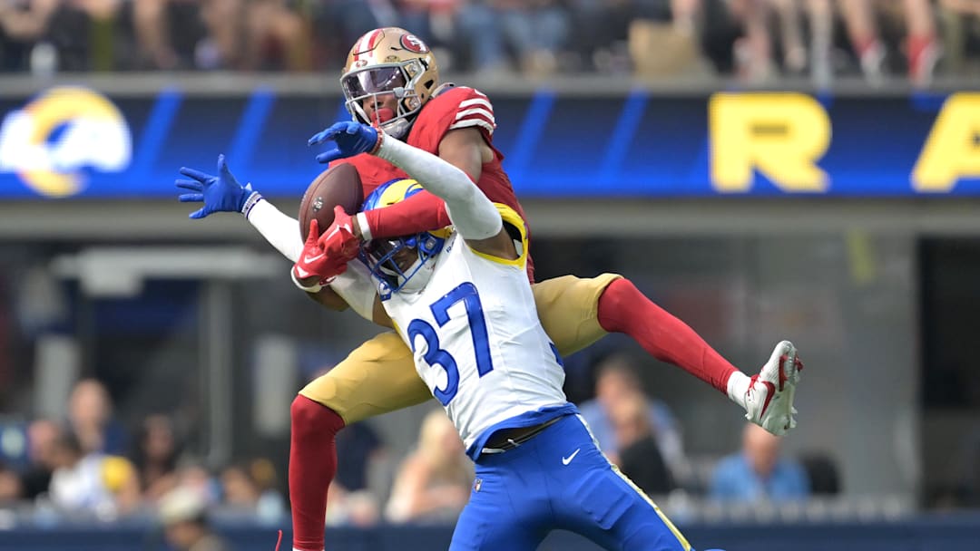 Sep 22, 2024; Inglewood, California, USA;  Los Angeles Rams safety Quentin Lake (37) breaks up a pass for San Francisco 49ers wide receiver Jauan Jennings (15) in the second half at SoFi Stadium. Mandatory Credit: Jayne Kamin-Oncea-Imagn Images