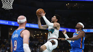 Apr 24, 2025; Memphis, Tennessee, USA; Memphis Grizzlies guard Scotty Pippen Jr. (1) drives to the basket as Oklahoma City Thunder guard Shai Gilgeous-Alexander (2) defends during the second quarter during game three for the first round of the 2024 NBA Playoffs at FedExForum. Mandatory Credit: Petre Thomas-Imagn Images