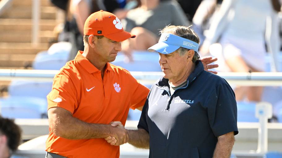 Clemson Tigers head coach Dabo Swinney with North Carolina Tar Heels head coach Bill Belichick.