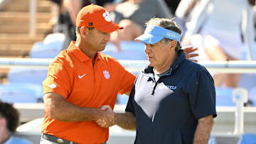 Oct 4, 2025; Chapel Hill, North Carolina, USA; Clemson Tigers head coach Dabo Swinney with North Carolina Tar Heels head coach Bill Belichick before the game at Kenan Stadium. Mandatory Credit: Bob Donnan-Imagn Images