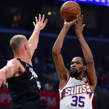 Apr 10, 2024; Los Angeles, California, USA; Phoenix Suns forward Kevin Durant (35) shoots against Los Angeles Clippers center Mason Plumlee (44) during the second half at Crypto.com Arena. Mandatory Credit: Gary A. Vasquez-USA TODAY Sports