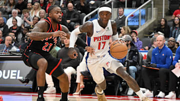 Apr 4, 2025; Toronto, Ontario, CAN;  Detroit Pistons guard Dennis Schroder (17) dribbles the ball past Toronto Raptors guard Jamal Shead (23) in the first half at Scotiabank Arena. Mandatory Credit: Dan Hamilton-Imagn Images