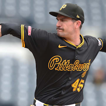 May 21, 2025; Pittsburgh, Pennsylvania, USA;  Pittsburgh Pirates starting pitcher Andrew Heaney (45) delivers a pitch against the Cincinnati Reds during the first inning at PNC Park. Mandatory Credit: Charles LeClaire-Imagn Images