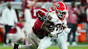 Sep 28, 2024; Tuscaloosa, Alabama, USA;  Georgia Bulldogs wide receiver Dillon Bell (86) runs the ball against Alabama Crimson Tide defensive back Keon Sabb (3) during the fourth quarter at Bryant-Denny Stadium. Mandatory Credit: John David Mercer-Imagn Images