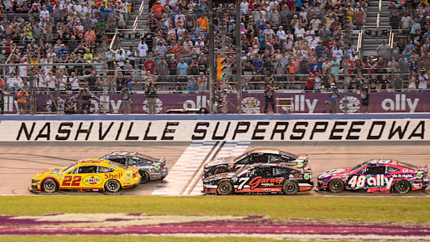 NASCAR Cup Series driver Joey Logano (22) crosses the finish line  during the Ally 400 at Nashville Superspeedway. 