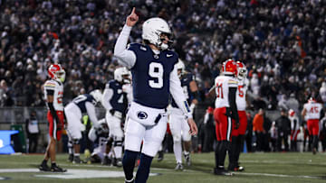 Nov 30, 2024; University Park, Pennsylvania, USA; Penn State Nittany Lions quarterback Beau Pribula (9) celebrates after scoring a touchdown against the Maryland Terrapins during the second quarter at Beaver Stadium. Mandatory Credit: Matthew O'Haren-Imagn Images