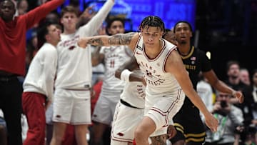 Mar 13, 2024; Nashville, TN, USA; Arkansas Razorbacks forward Trevon Brazile (2) celebrates after a basket in overtime against the Vanderbilt Commodores at Bridgestone Arena. Mandatory Credit: Christopher Hanewinckel-Imagn Images