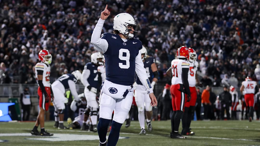 Nov 30, 2024; University Park, Pennsylvania, USA; Penn State Nittany Lions quarterback Beau Pribula (9) celebrates after scoring a touchdown against the Maryland Terrapins during the second quarter at Beaver Stadium.