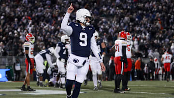 Nov 30, 2024; University Park, Pennsylvania, USA; Penn State Nittany Lions quarterback Beau Pribula (9) celebrates after scoring a touchdown against the Maryland Terrapins during the second quarter at Beaver Stadium. Mandatory Credit: Matthew O'Haren-Imagn Images