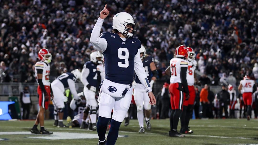 Nov 30, 2024; University Park, Pennsylvania, USA; Penn State Nittany Lions quarterback Beau Pribula (9) celebrates after scoring a touchdown against the Maryland Terrapins during the second quarter at Beaver Stadium. Mandatory Credit: Matthew O'Haren-Imagn Images