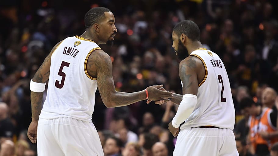 Cleveland Cavaliers guard JR Smith and guard Kyrie Irving greet each other. | Ken Blaze-Imagn Images