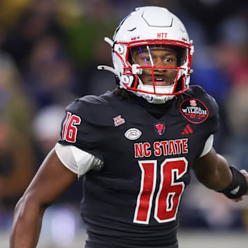 Nov 21, 2024; Atlanta, Georgia, USA; North Carolina State Wolfpack quarterback CJ Bailey (16) in action against the Georgia Tech Yellow Jackets in the second quarter at Bobby Dodd Stadium at Hyundai Field. Mandatory Credit: Brett Davis-Imagn Images