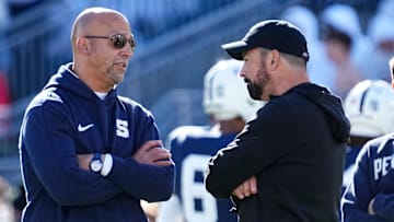 Penn State's James Franklin, left, talks to Ohio State's Ryan Day