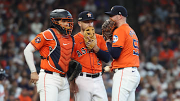 Oct 2, 2024; Houston, Texas, USA; Houston Astros pitcher Ryan Pressly (55) talks with catcher Yainer Diaz (21) and third base Alex Bregman (2) during the eighth inning of game two of the Wildcard round for the 2024 MLB Playoffs against the Detroit Tigers at Minute Maid Park. Mandatory Credit: Thomas Shea-Imagn Images