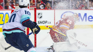 Dec 27, 2023; Calgary, Alberta, CAN; Calgary Flames goaltender Jacob Markstrom (25) makes a save against Seattle Kraken during the third period at Scotiabank Saddledome. Mandatory Credit: Sergei Belski-Imagn Images
