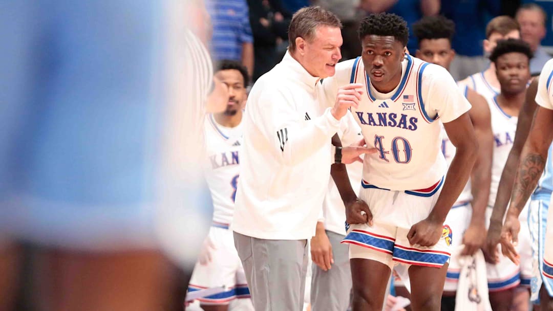 Kansas Jayhawks head coach Bill Self talks with Kansas Jayhawks forward Flory Bidunga (40) in the first half of the game against North Carolina Tar Heels inside Allen Fieldhouse Friday, Nov. 8, 2024.