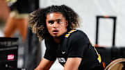 Oct 20, 2023; Carrollton, GA, USA; Carrollton Trojans quarterback Julian Lewis (10) watches on from the sidelines against the Westlake Lions during the first half at Grisham Stadium. The 15-year-old Carrollton High student has already committed to playing for the University of Southern California Trojans and has been considered one of the top high school quarterback prospects. 
